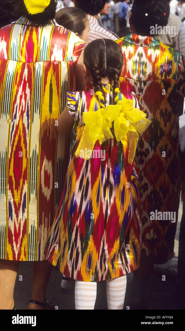 Uzbek women wear the latest bright colour color geometric pattern fashion fabric dresses Stock Photo