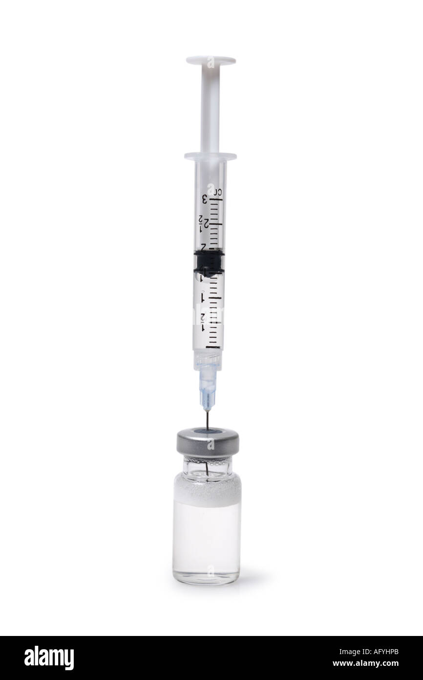 Syringe sticking in Medicine Vile Stock Photo