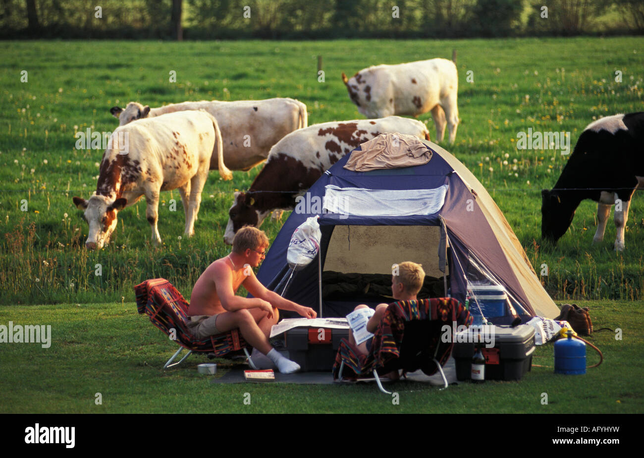 Netherlands Emmen Friends camping on farm Stock Photo