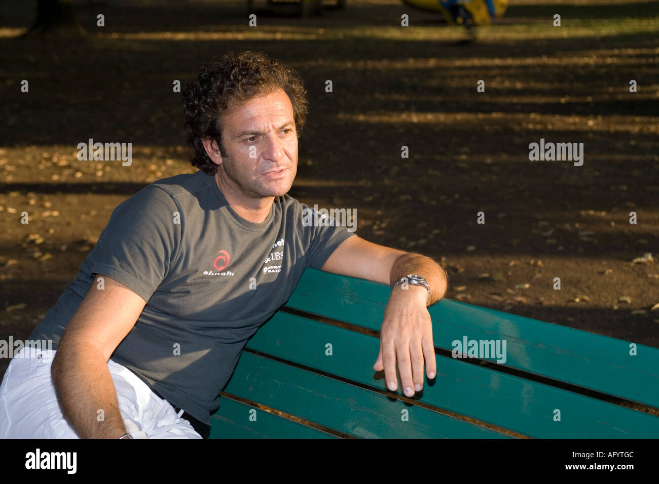Old italian man on bench hi-res stock photography and images - Alamy