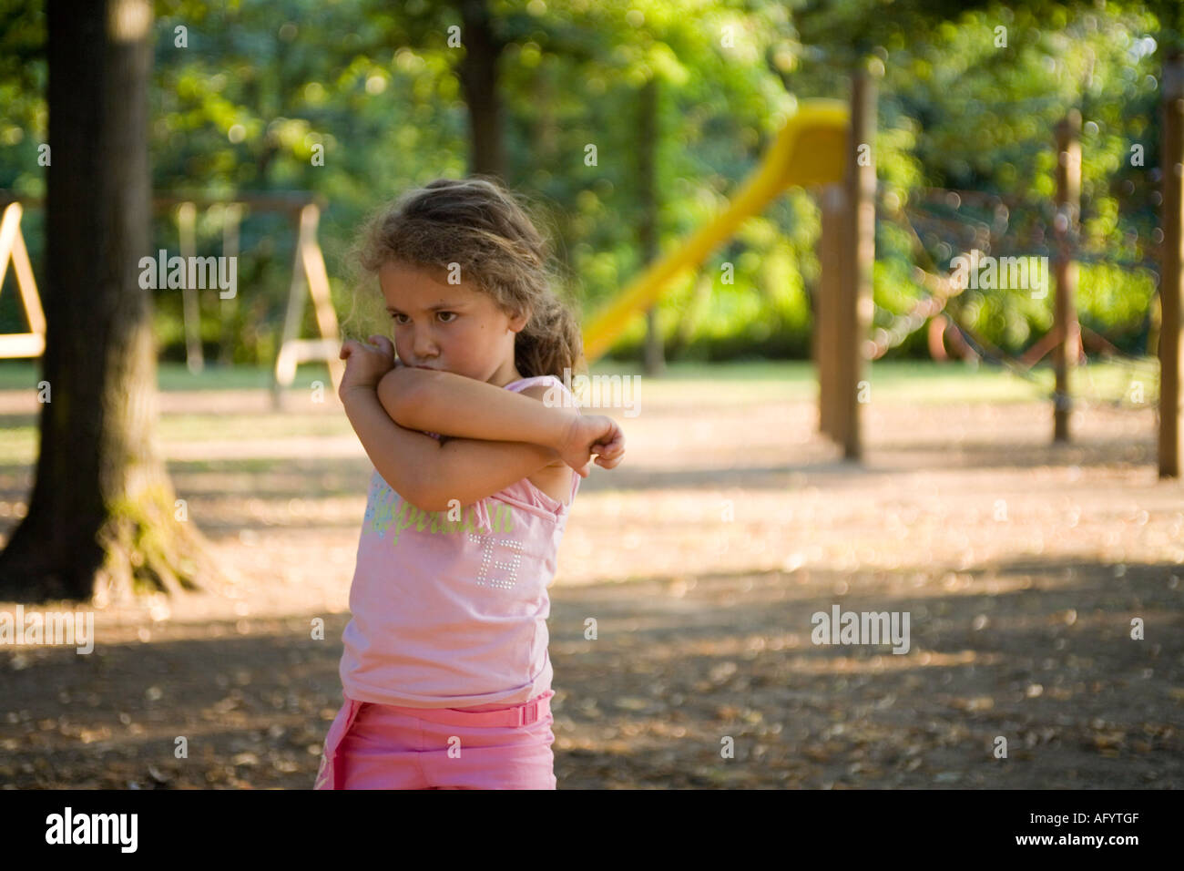 upset little girl at the park Stock Photo - Alamy