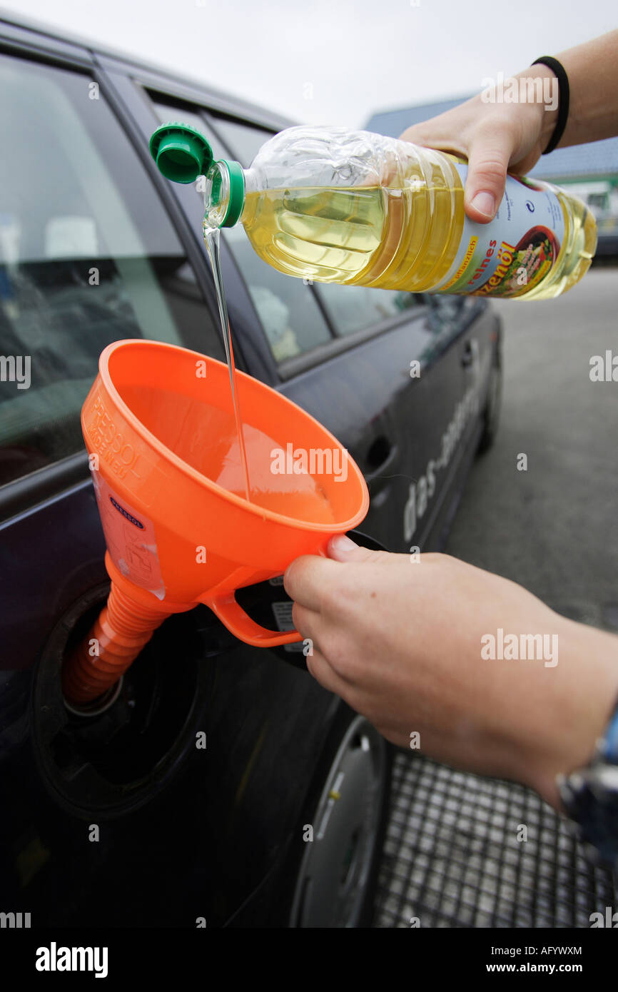 Man fueling his car with vegetable oil, Germany Stock Photo Alamy