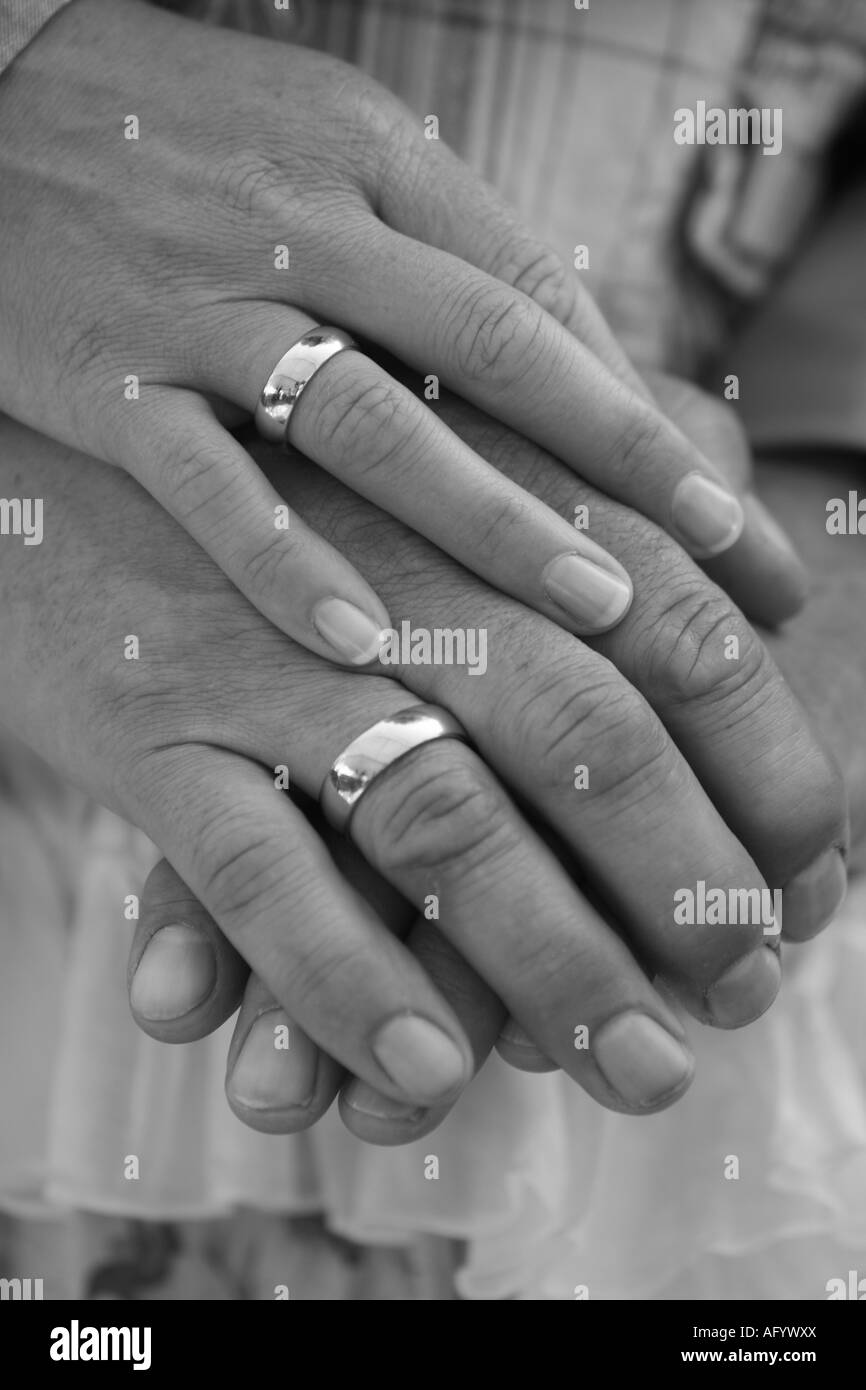 Hands of a married couple Stock Photo