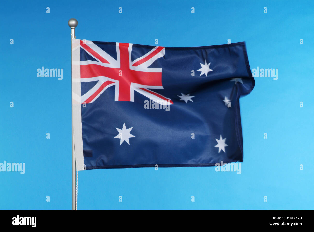 Australian national flag against blue sky Stock Photo