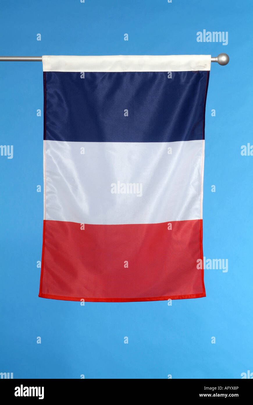 French national flag against blue sky Stock Photo