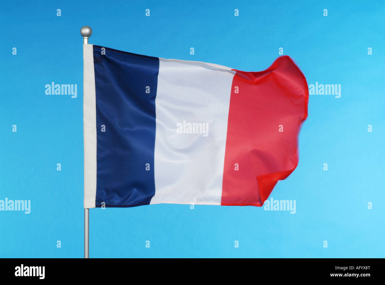 French national flag against blue sky Stock Photo