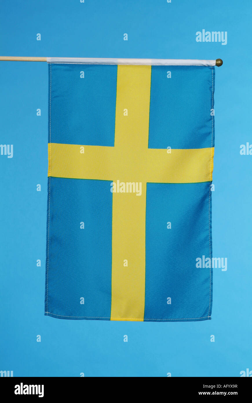 Swedish national flag against blue sky Stock Photo