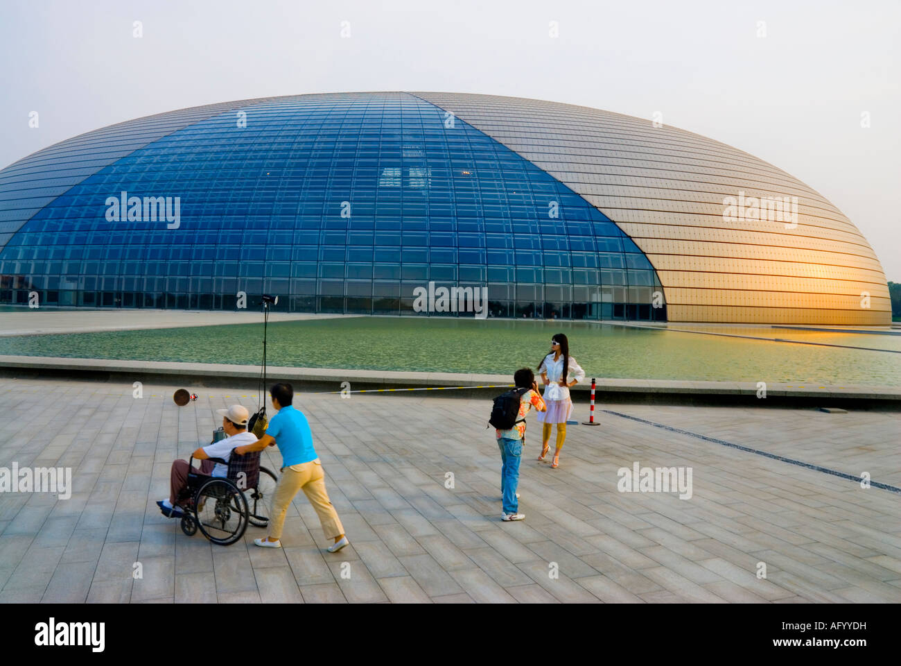 Beijing CHINA, Photographer Shooting Fashion Model in Front of the 'National Grand Theatre' (Credit Architect 'Paul Andreu') special needs access, Stock Photo