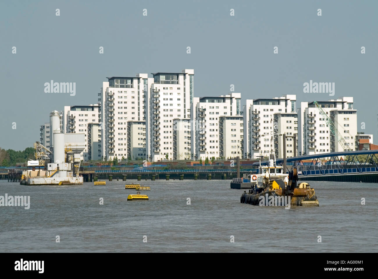River Thames at North Woolwich with blocks of high rise homes on the