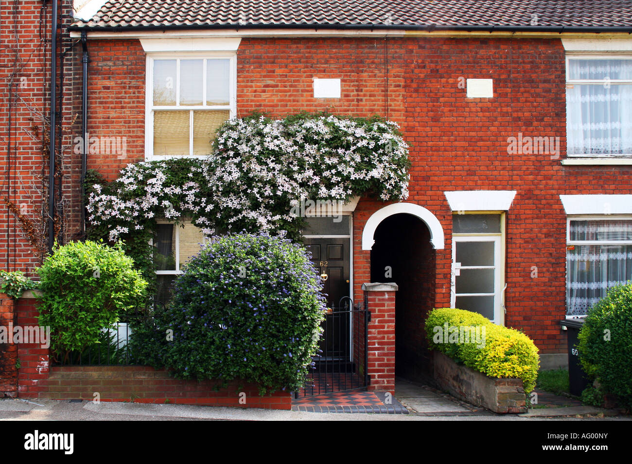 Facade of small terrace house garden in English city Stock Photo