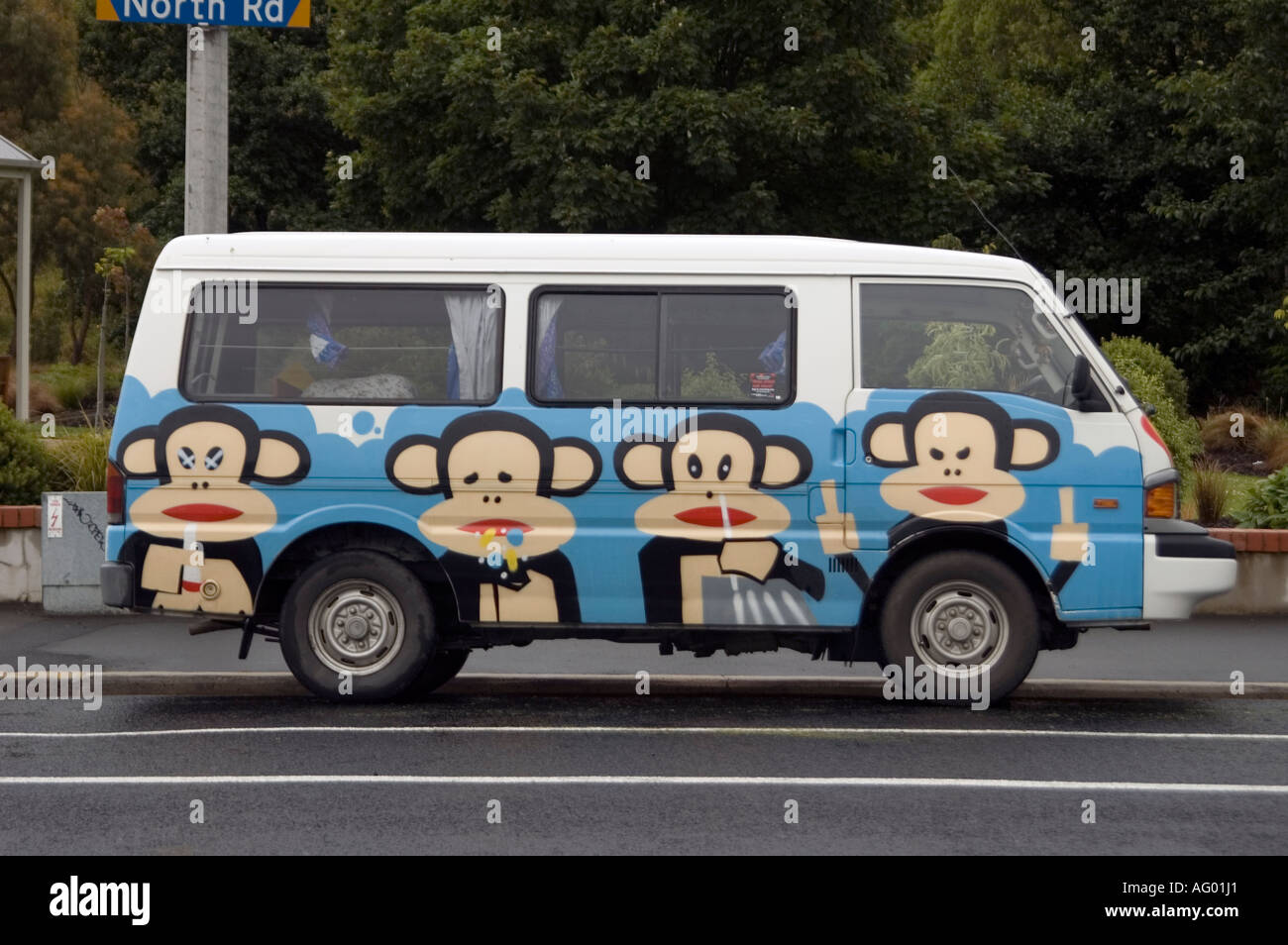wacky looking van with three monkeys painted on side Stock Photo