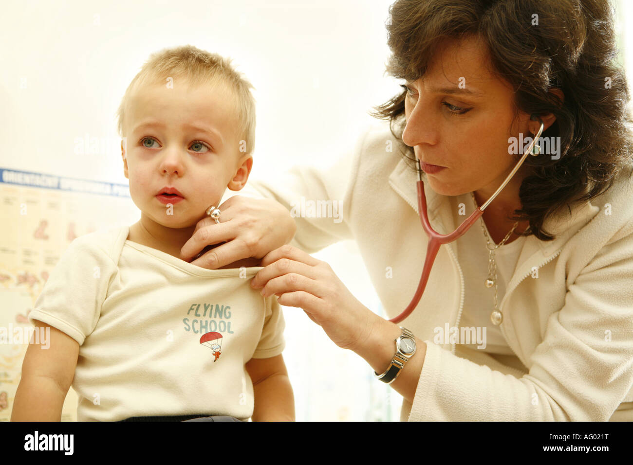 Doctor examinate child with stethoscope Stock Photo