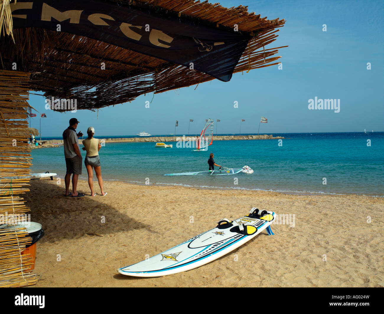 A couple on the beach at the Hilton Hotel Watersports Centre Hurghada Stock Photo