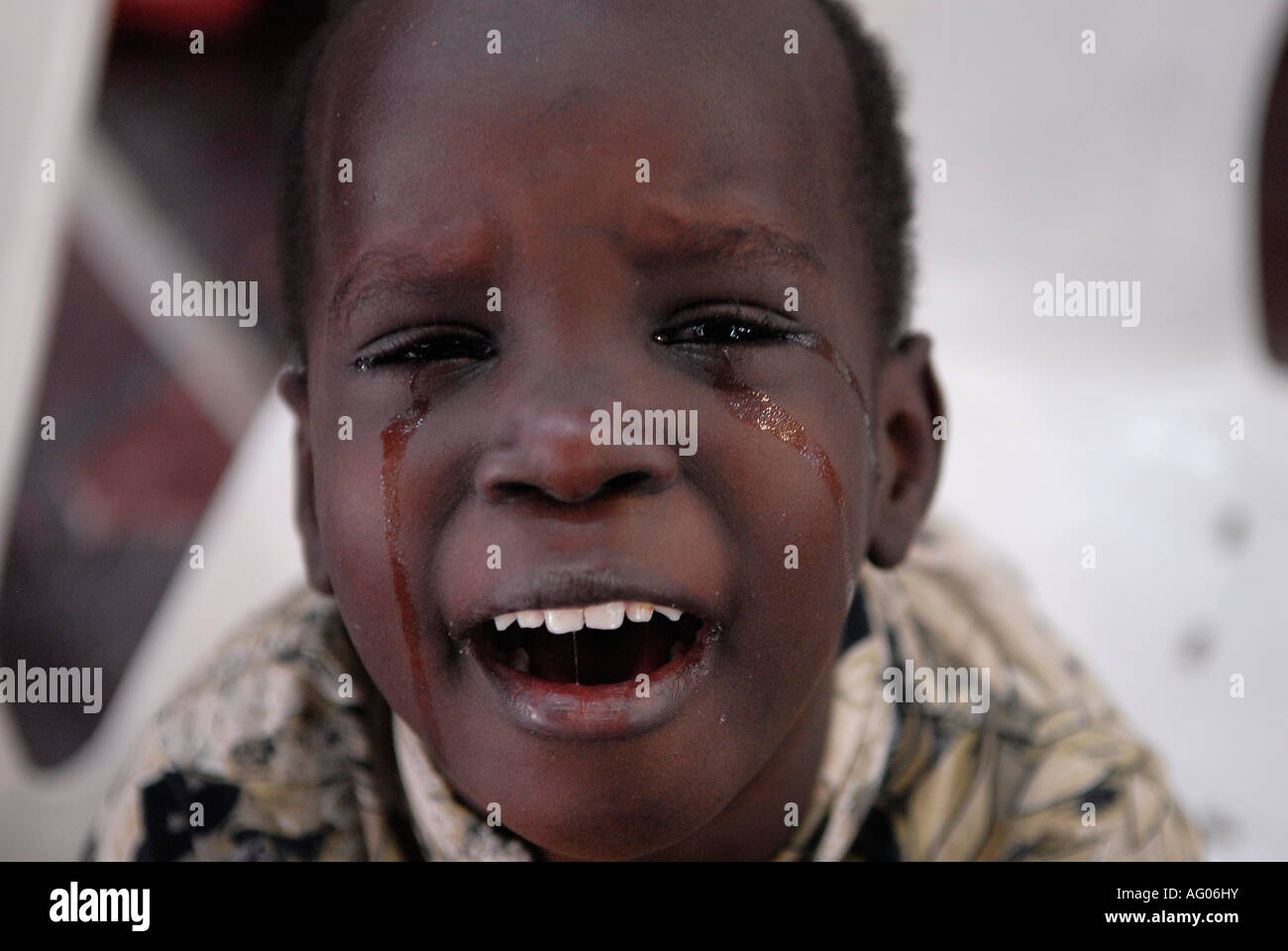 Young African boy crying Stock Photo