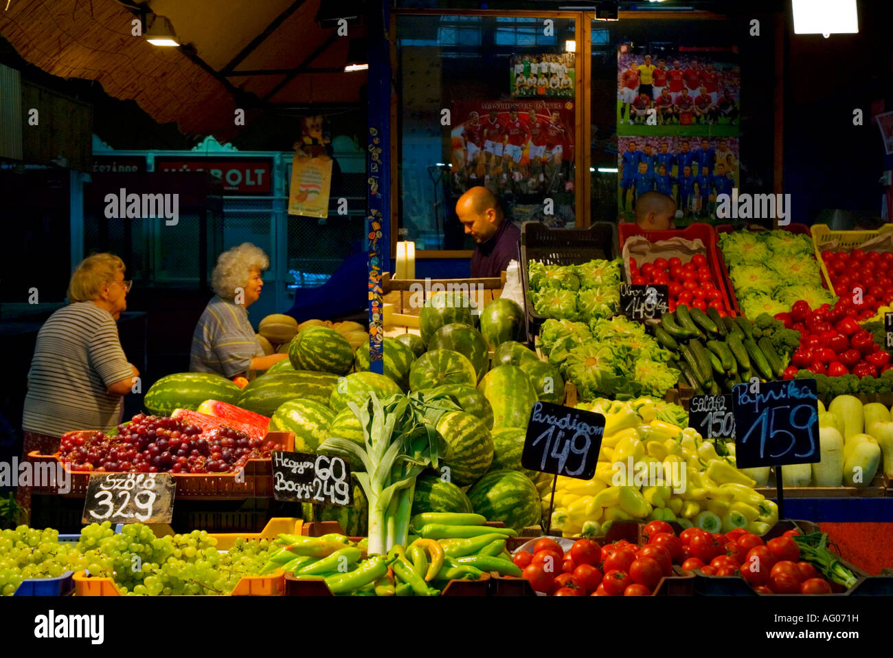 People shopping for fresh produce in market hall at Hunyadi ter square