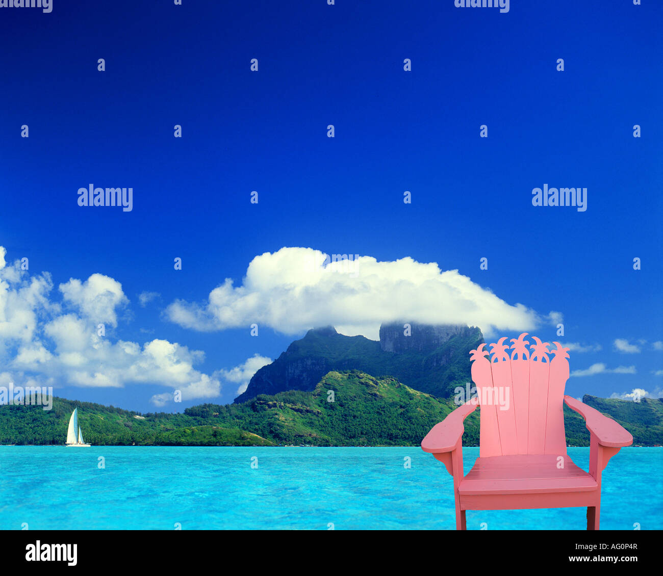 Pink chair and palm trees with Bora Bora, Tahiti Stock Photo
