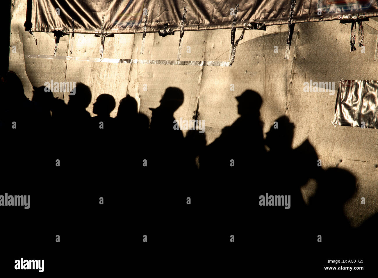 Shadows of audience on tarpaulin at Guilfest Music Festival. Guildford, Surrey, England Stock Photo