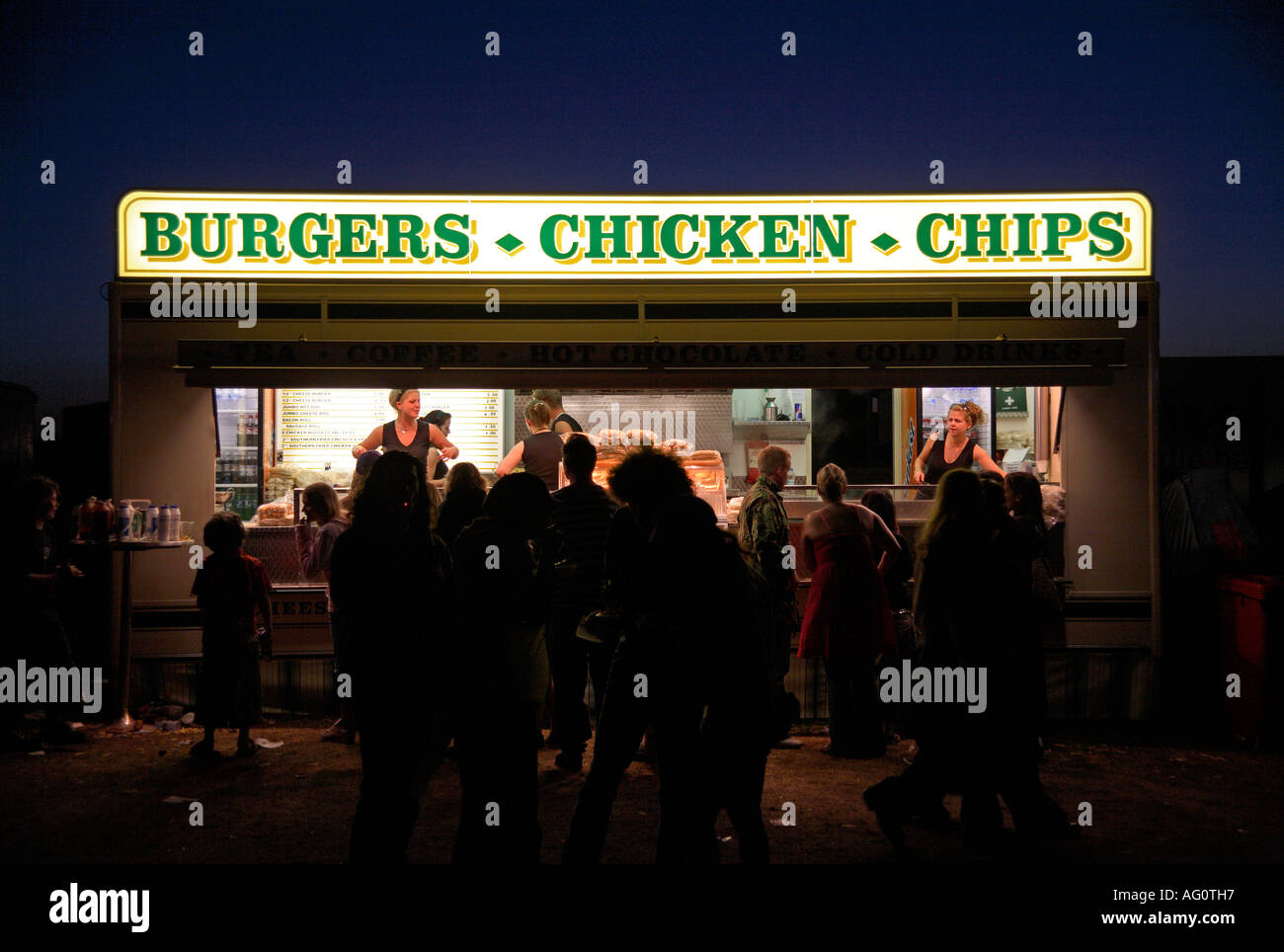 Burgers, chicken and chips van at night. Guilfest  Music Festival, Guildford, Surrey, England Stock Photo