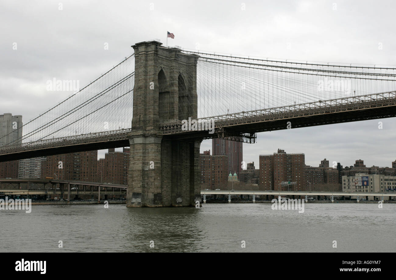 View of New York from beneath the Brooklyn Bridge shot from a boat on the east river new york city new york USA Stock Photo