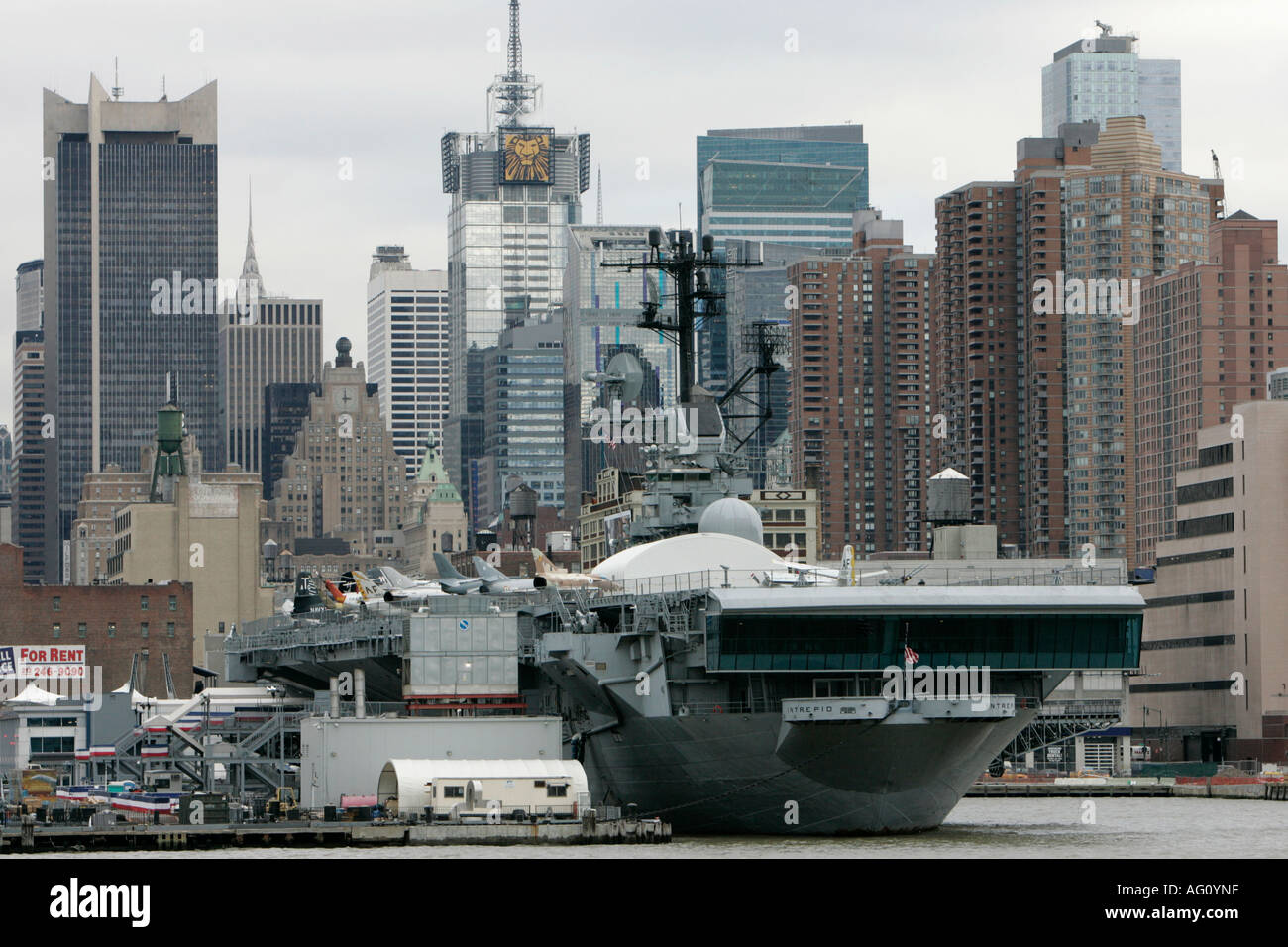 view of manhattan skyline USS Intrepid Aircraft Carrier at the Intrepid Sea Air Space Museum Stock Photo