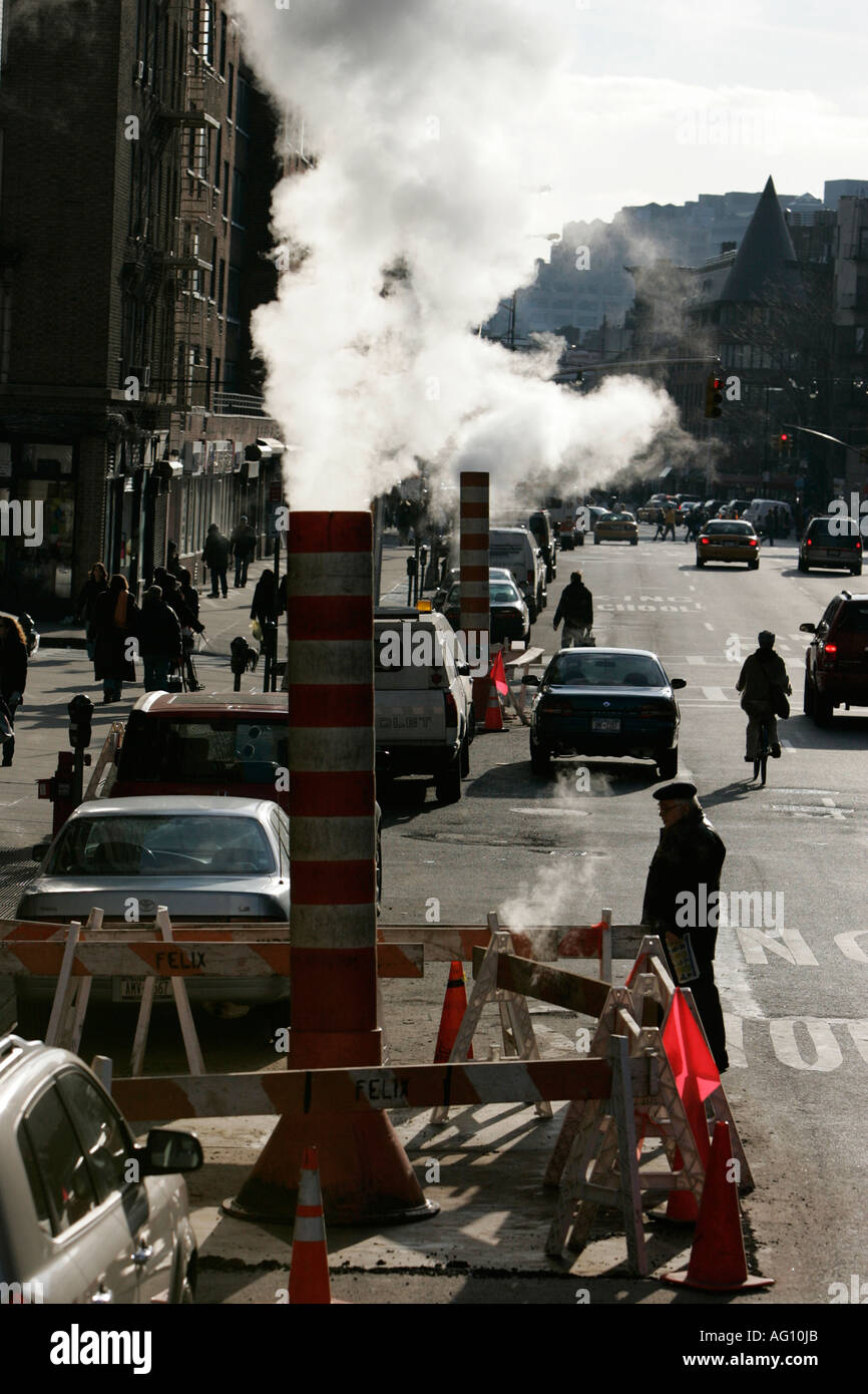 steam pipe vent stack backlit with traffic new york city new york USA Stock Photo