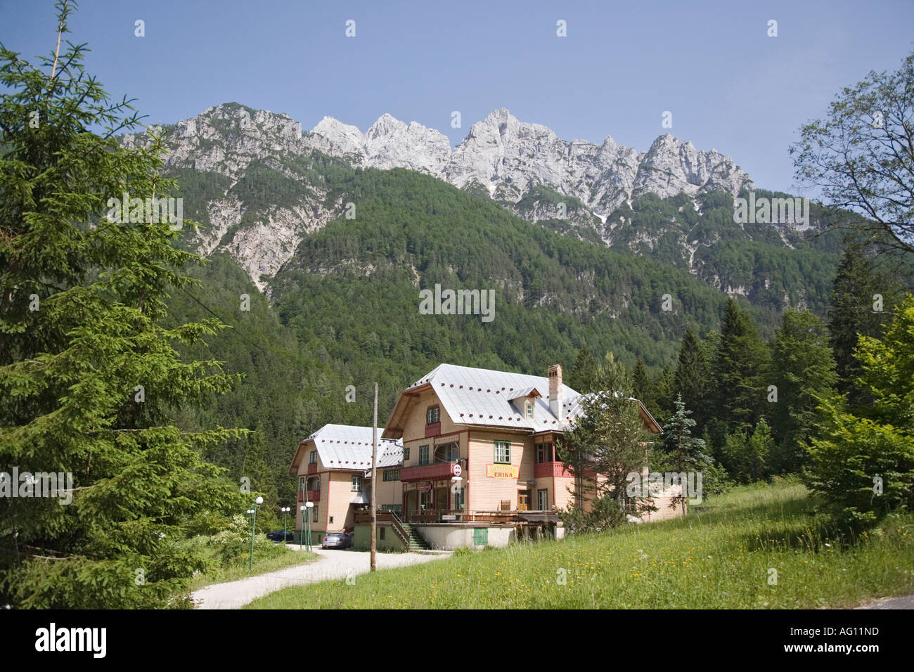 Hotel Erika in Pisnica valley with Martuljek mountains in 'Triglav National Park' beyond in summer. Kranjska Gora Slovenia Stock Photo