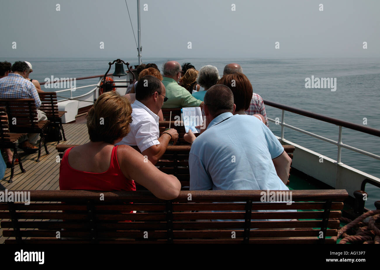 Tourist looking at map on ferry, Lake Garda, Italy Stock Photo