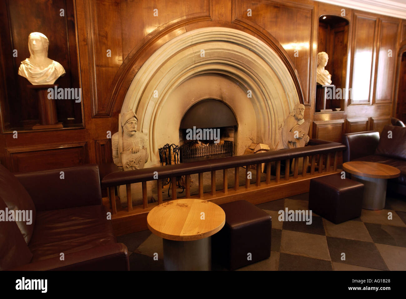 Stone Fireplace With Heraldic Figures In The Lounge Area Of