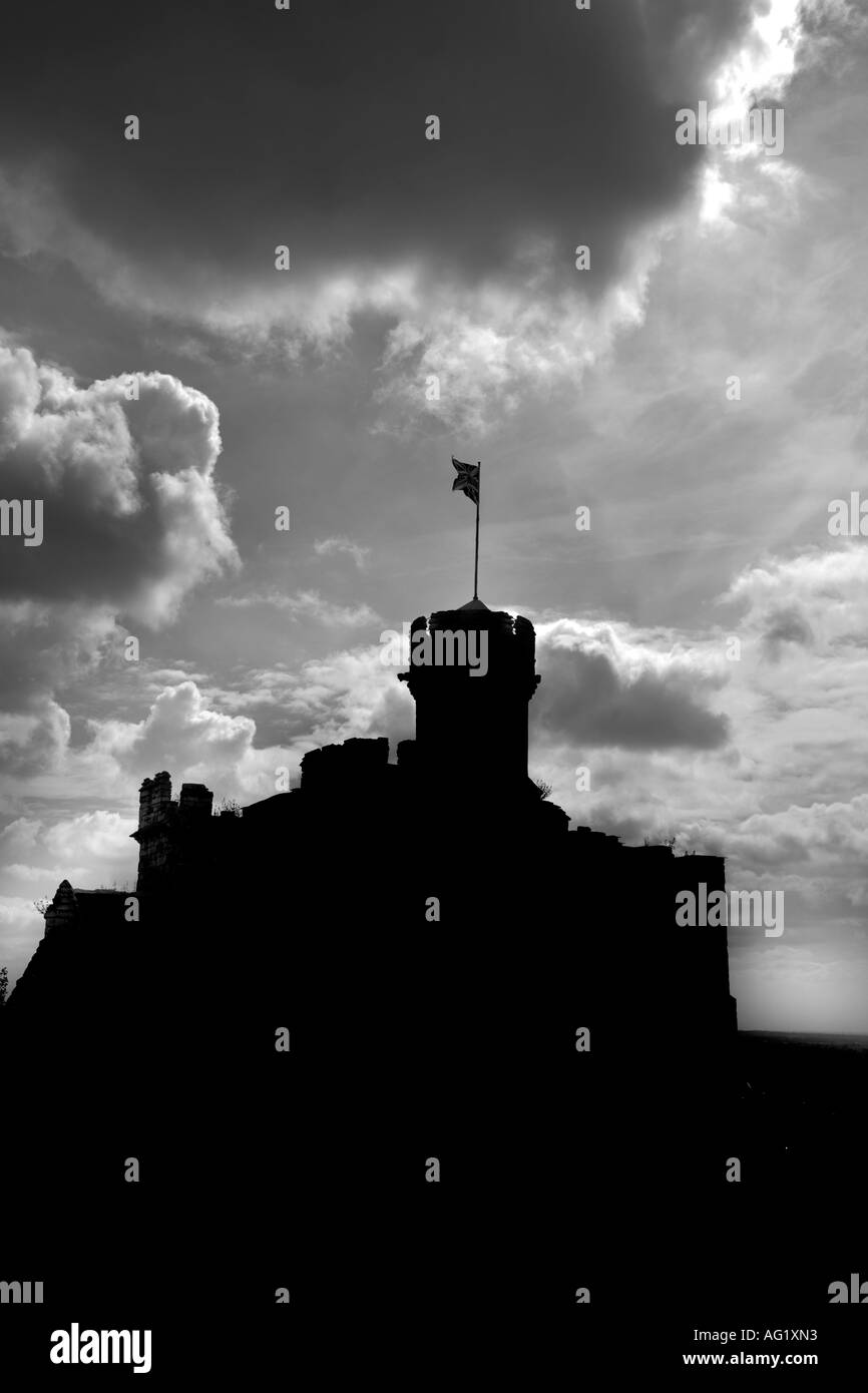 A MONO PHOTO OF LINCOLN CASTLE OBSERVATORY TOWER, SILHOUETTED AGAINST A CLOUD FILLED SKY Stock Photo