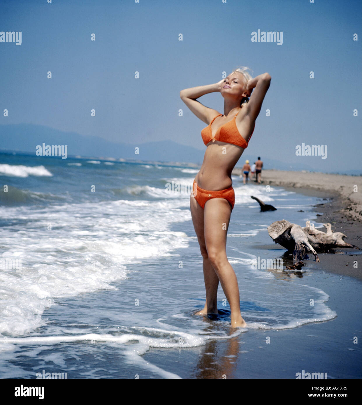 fashion, 1960s, woman, full length, wearing bikini, beach, , Stock Photo