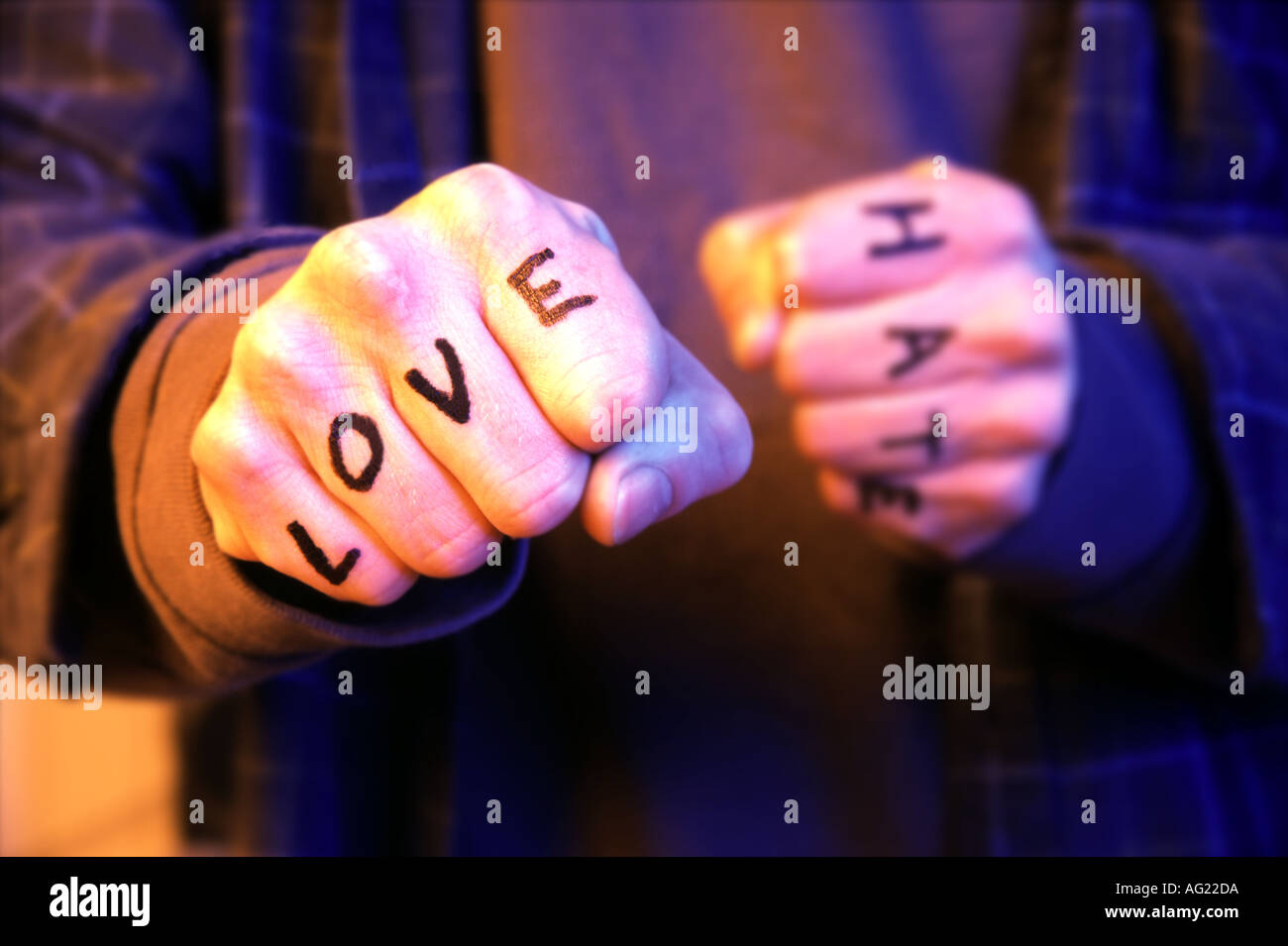 Fists with love and hate Stock Photo - Alamy