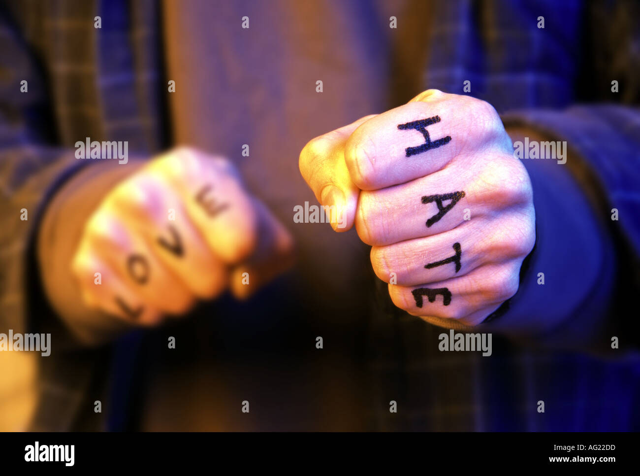 Fists with love and hate Stock Photo - Alamy