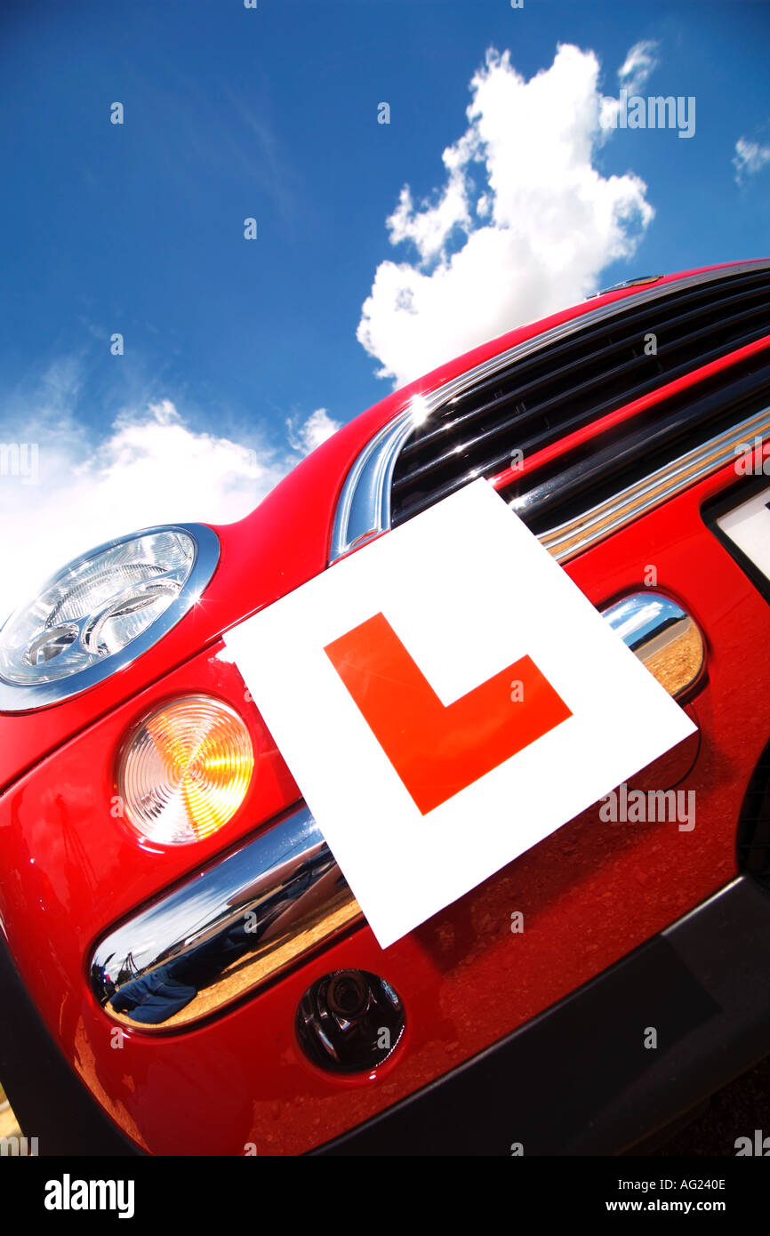 student Learner plates on a  red mini  big blue sky and sun Stock Photo