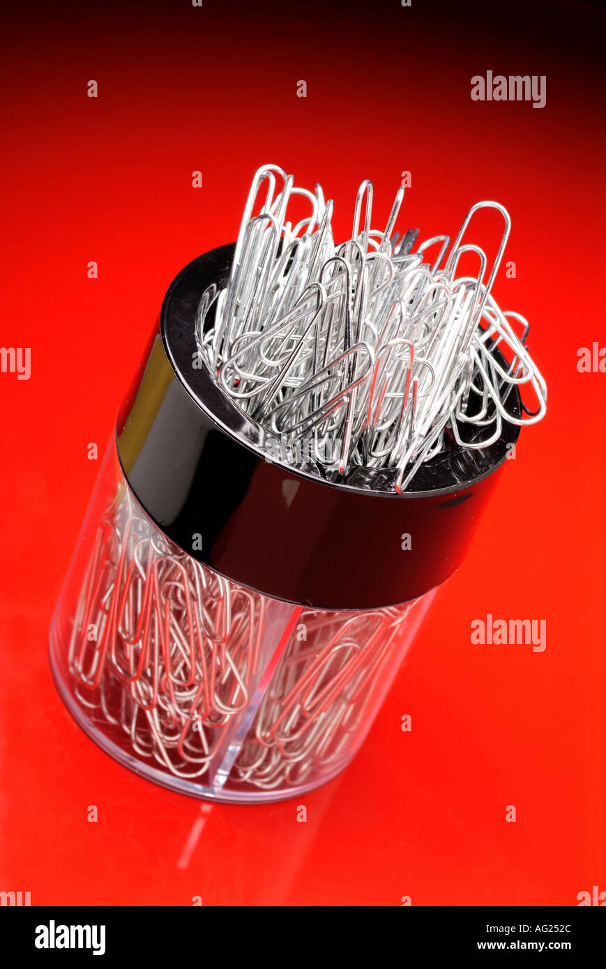 paper clip holder on red background Stock Photo Alamy