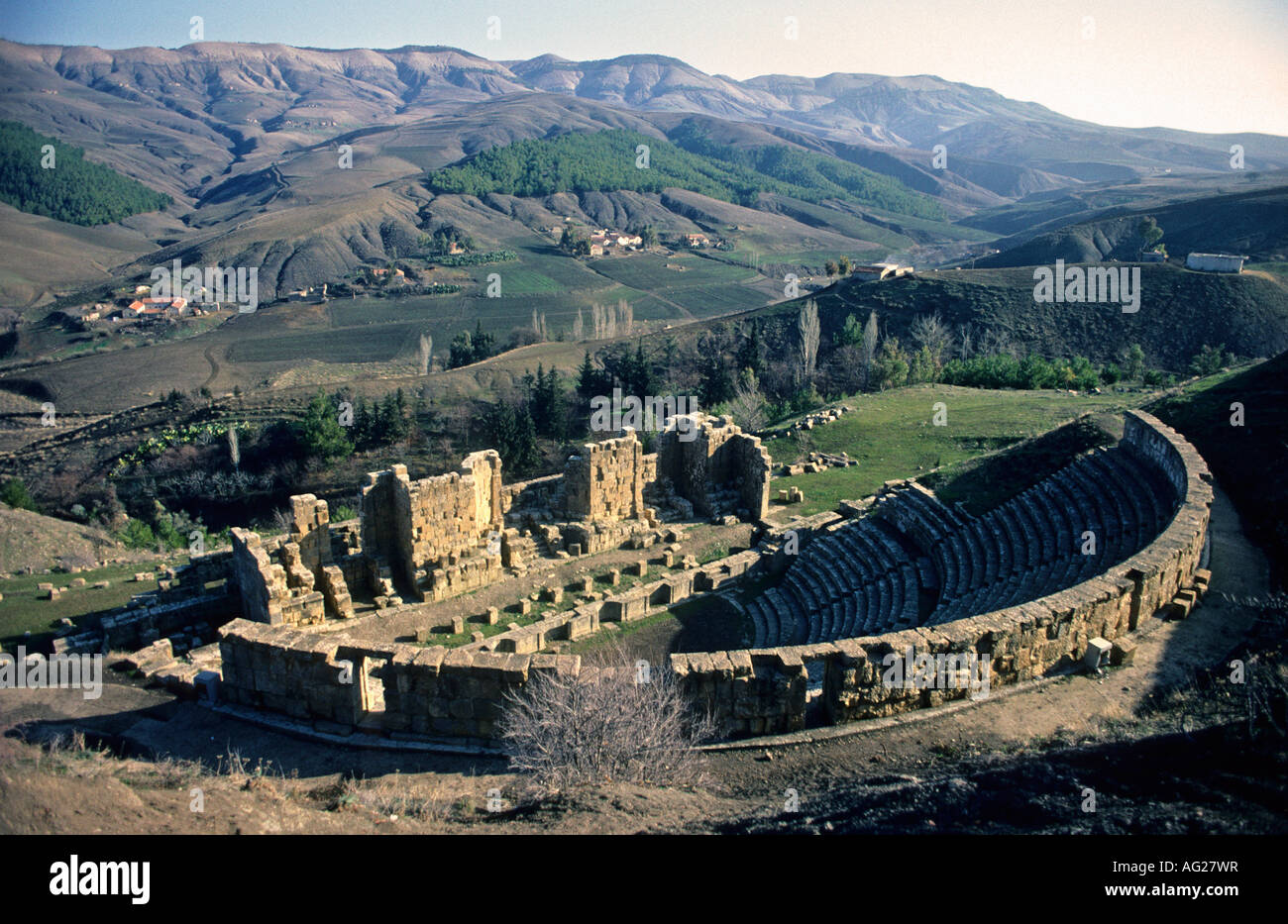 Algeria Djemila Roman ruins of amphitheatre and mountains Stock Photo
