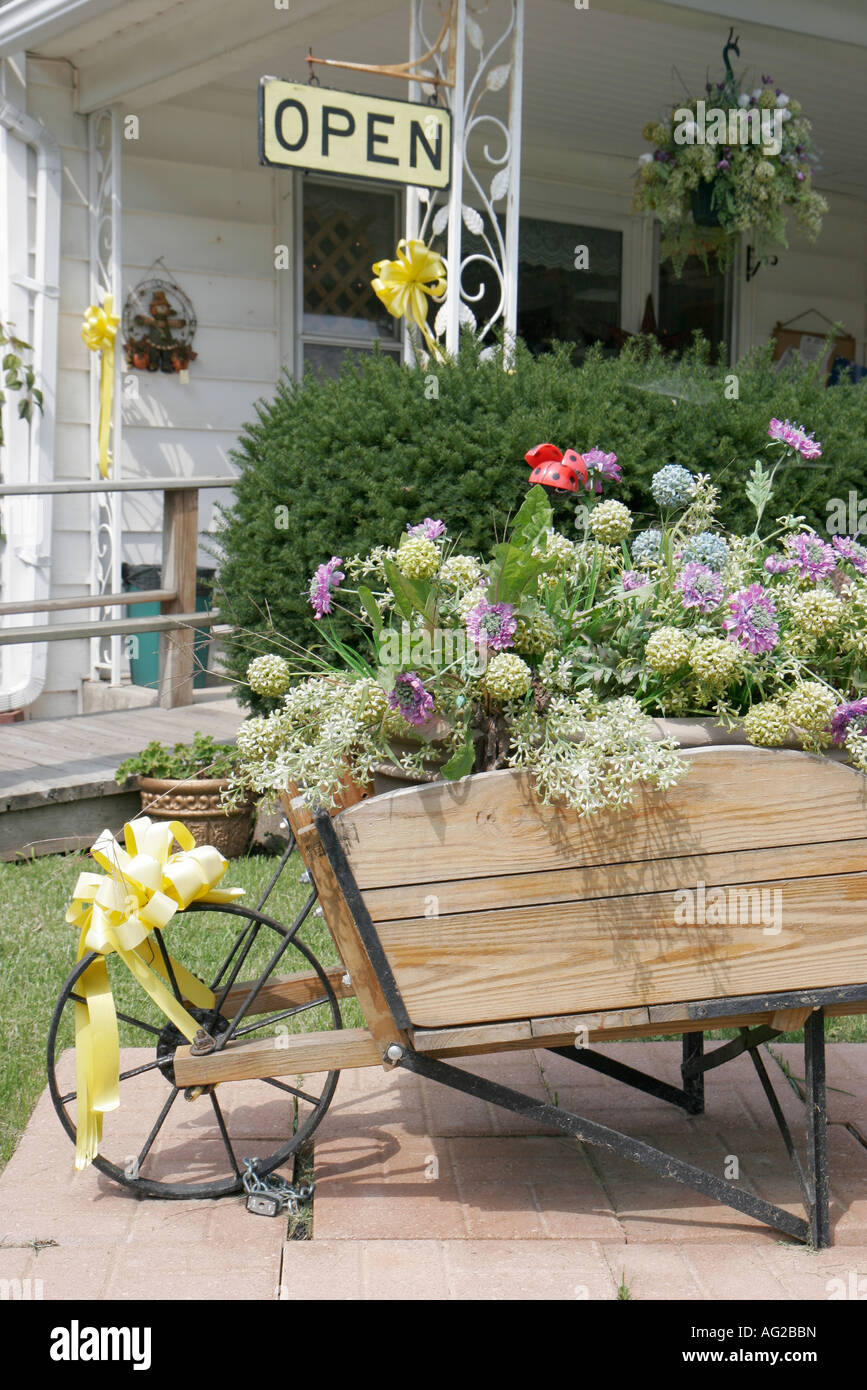 Shipshewana Indiana,East Middlebury Street,gift store,wheelbarrow,flower flowers,visitors travel traveling tour tourist tourism landmark landmarks cul Stock Photo