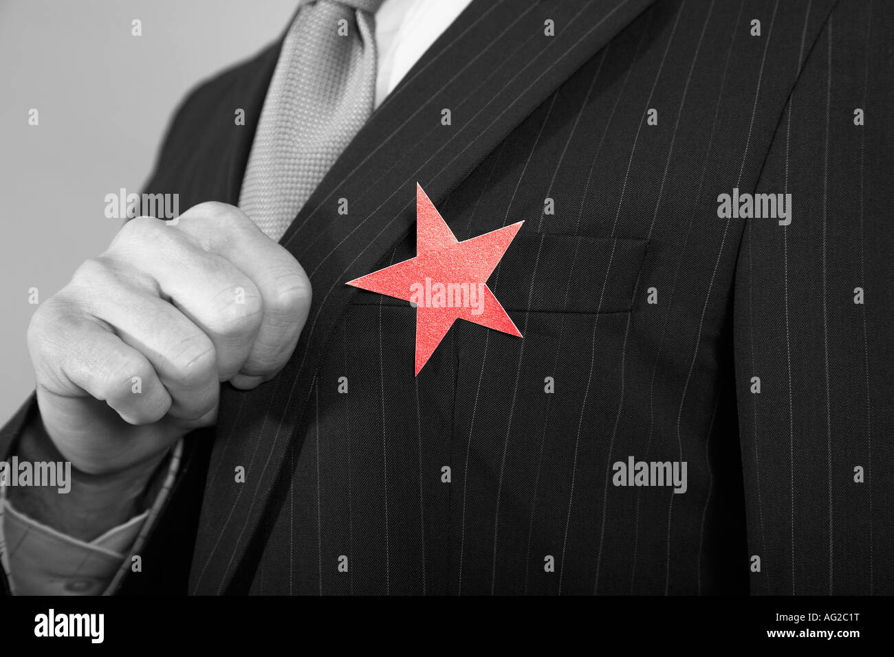 Businessman with Red Star on Suit Stock Photo