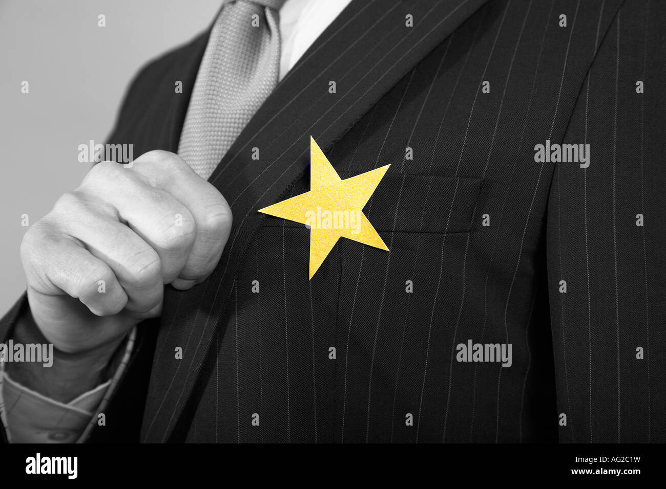 Businessmen with Golden Star on Suit Stock Photo