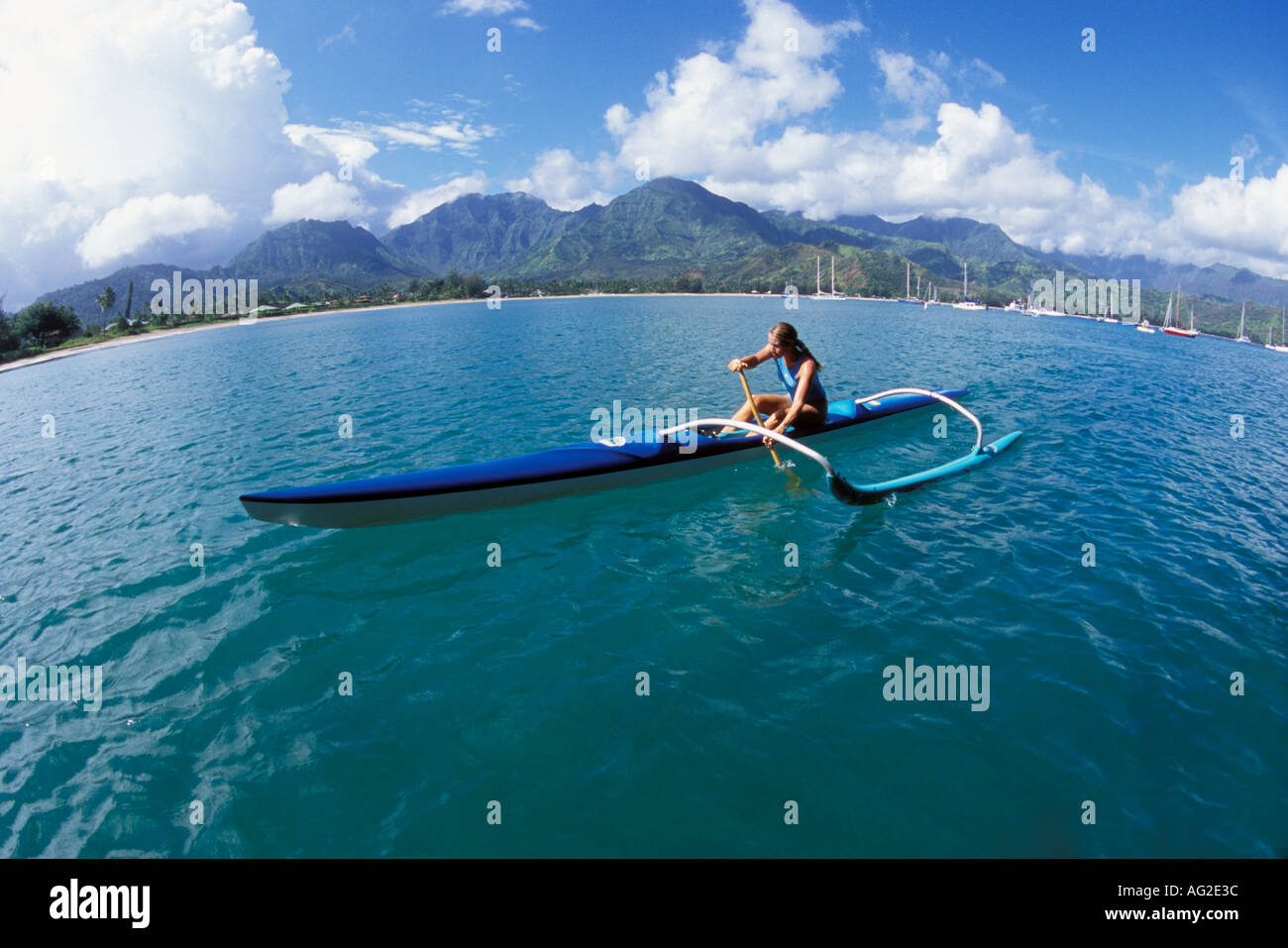 Hawaii Kauai Hanalei Bay woman paddling outrigger canoe MR available ...