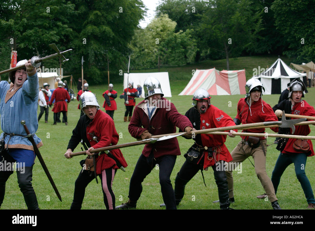 Medieval Soldiers charging with pikes. Stock Photo