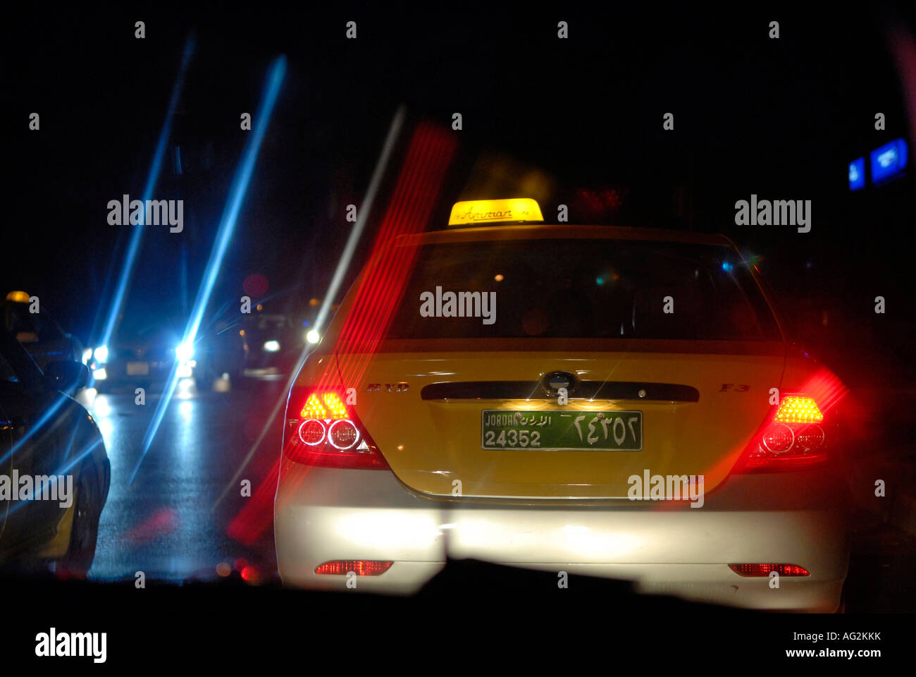 Beam of car lights in Amman Jordan Stock Photo