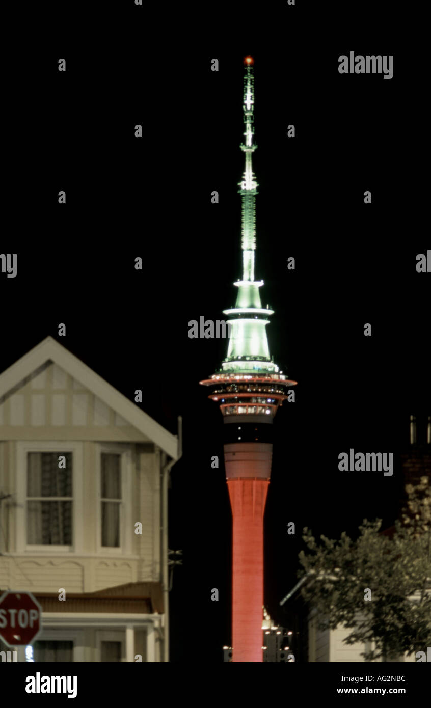 The Sky Tower Auckland New Zealand illuminated at night and viewed from suburban street Stock Photo