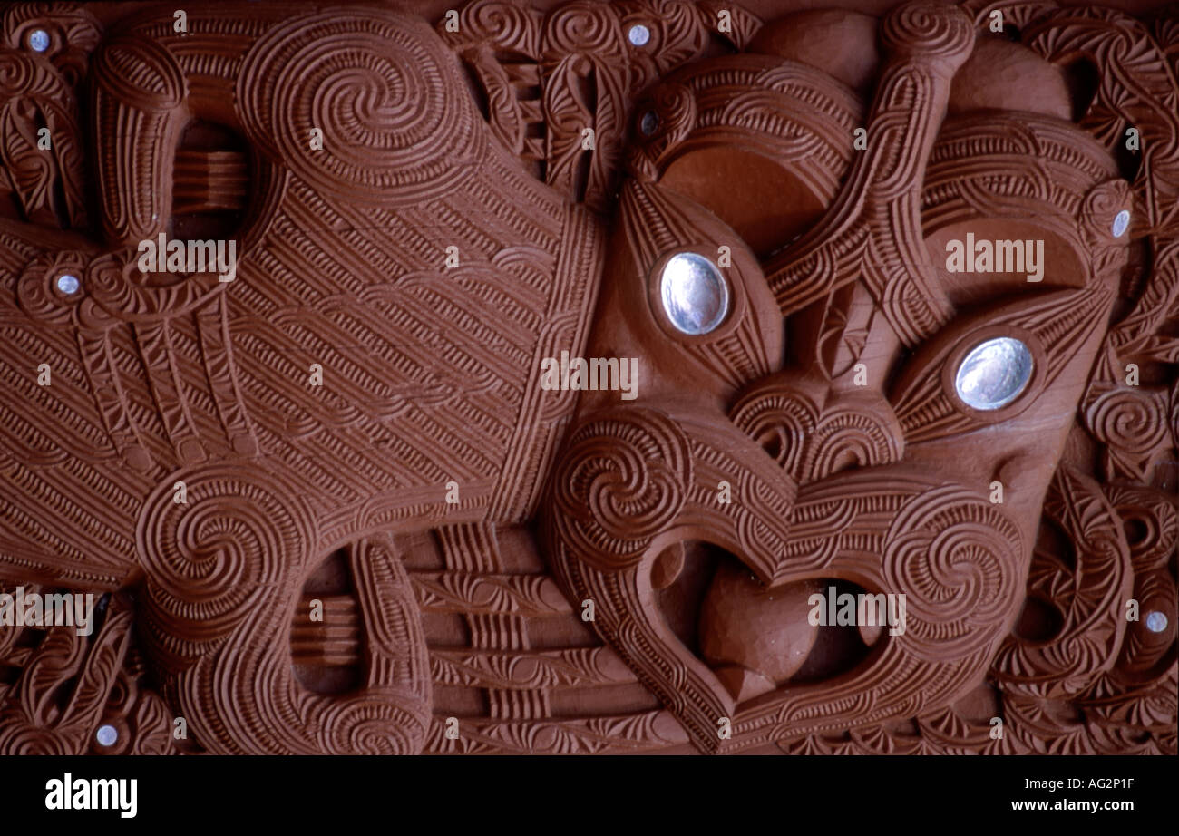 Traditional Maori carving showing face of a warrior Rotorua New Zealand Stock Photo