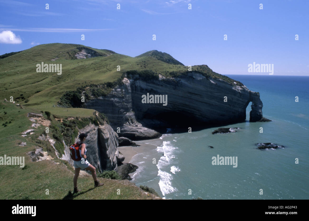 Coastal cliffs and cave near Farewell Spit and Wharariki Beach Golden Bay New Zealand Stock Photo