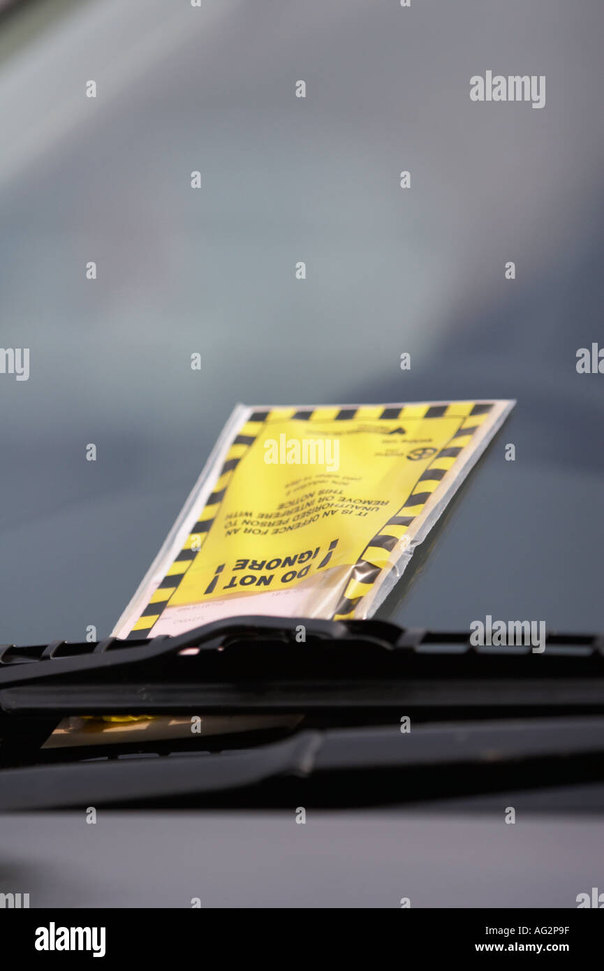 Parking ticket on windscreen Stock Photo