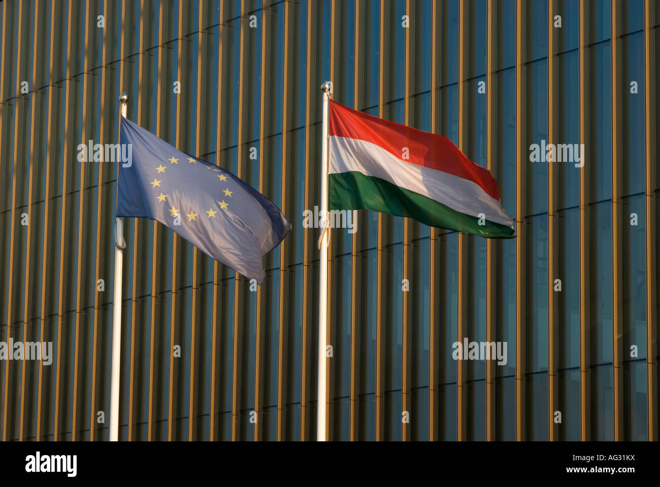 EU and Hungarian Flags at the Palace of Arts Muveszetek Palotaja Budapest Hungary Europe Stock Photo
