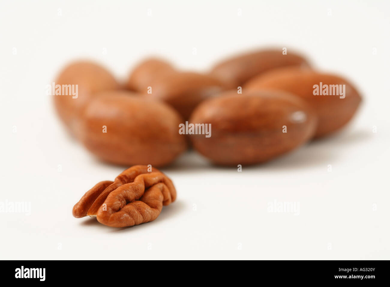 pecan nuts one shelled some in shells Carya illinoinensis, commonly misspelled illinoensis Stock Photo
