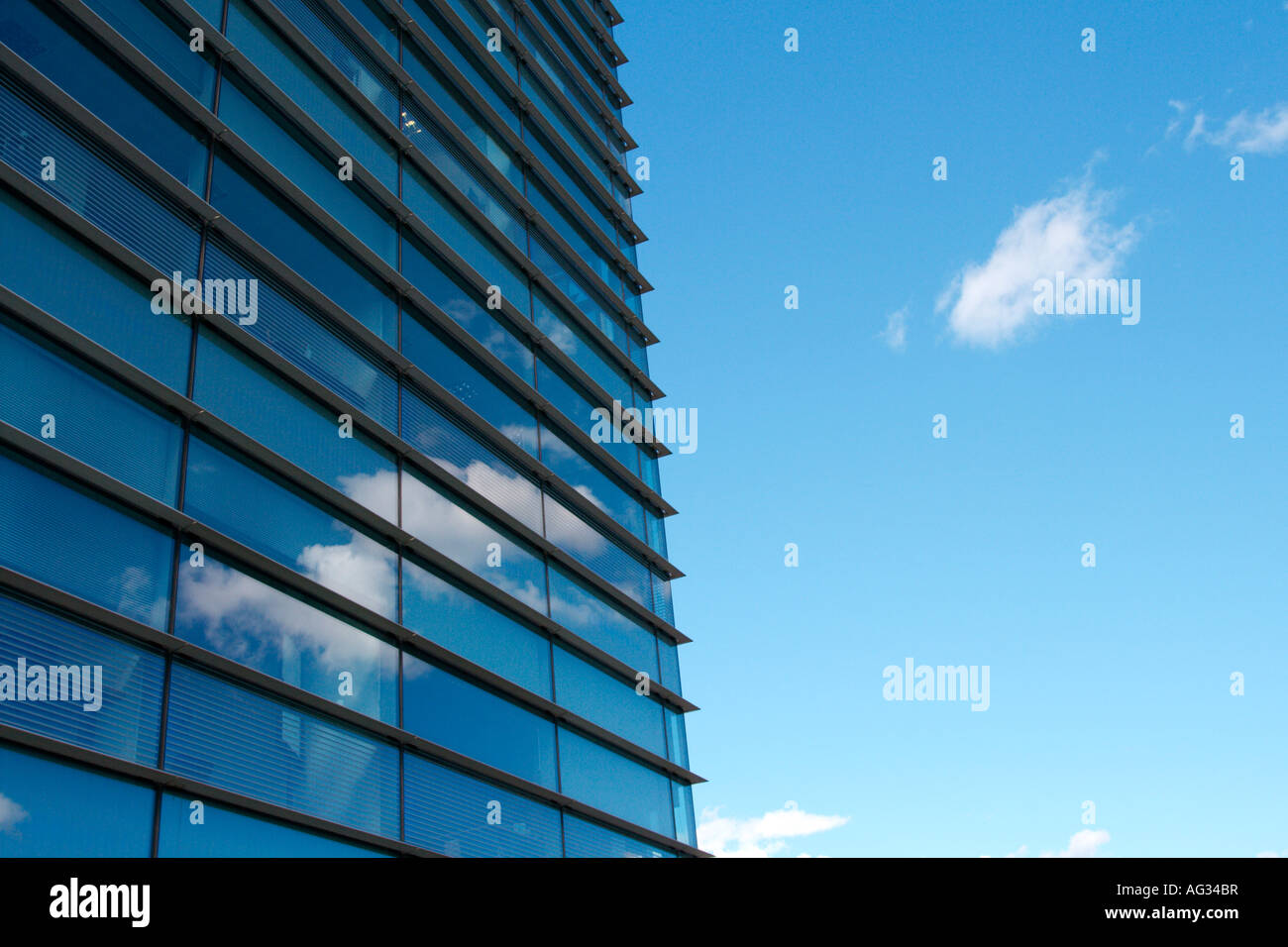 Clouds reflected in a glass office building Stock Photo - Alamy