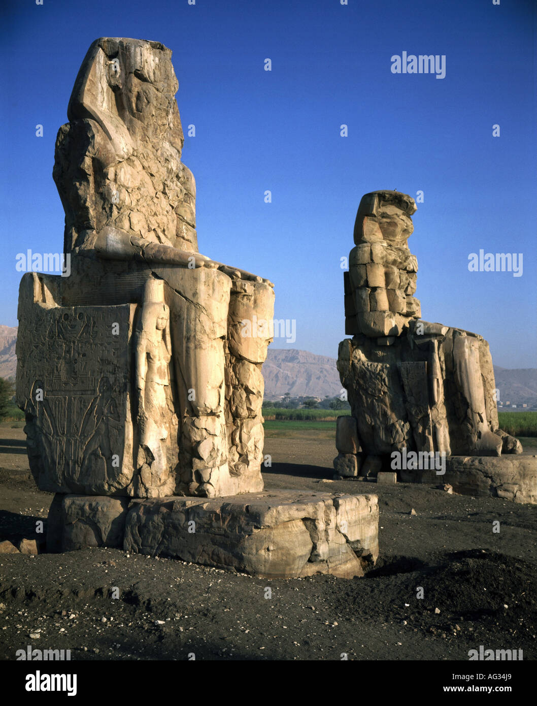 travel /geography, Egypt, Thebes, monuments, Colossi of Memnon, circa 1381 - 1351 B.C., historic, historical, Africa, architecture, monument, ancient world, New Kingdom, 18th dynasty, 14th century B.C., pharaoh Amenhotep III, queen Teje, colossus,UNESCO World Cultural Heritage Site, ancient world, Stock Photo
