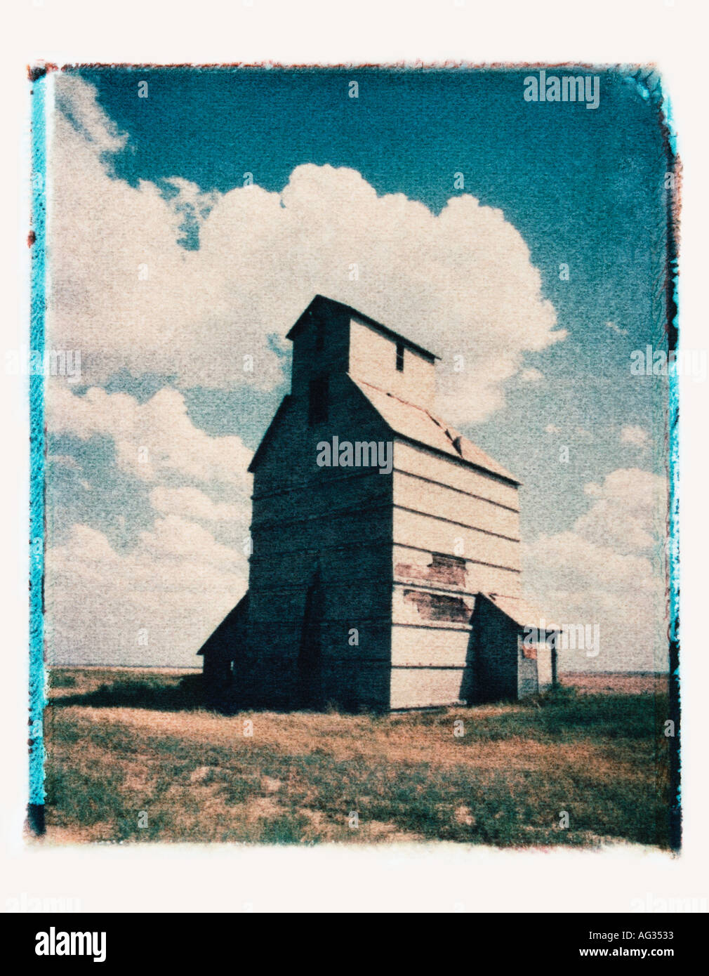 Polaroid transfer image of grain silo in Kansas USA Stock Photo